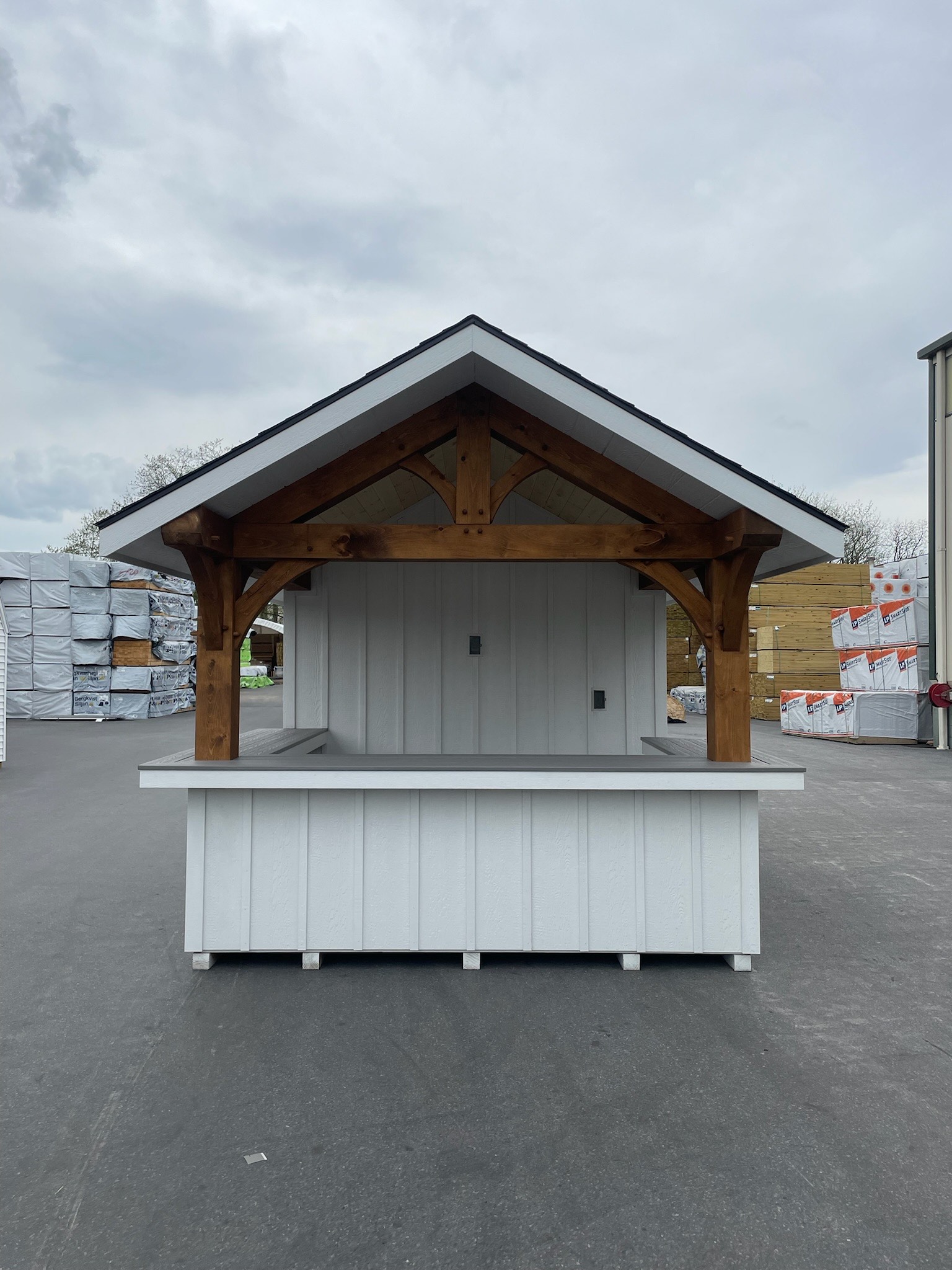 Pool bar with an open serving front and timber gable accents